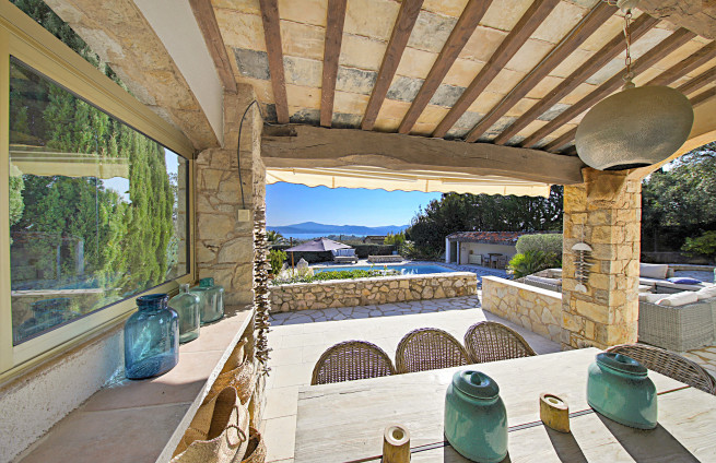 covered terrace with fireplace, evening on the French Riviera, Grimaud