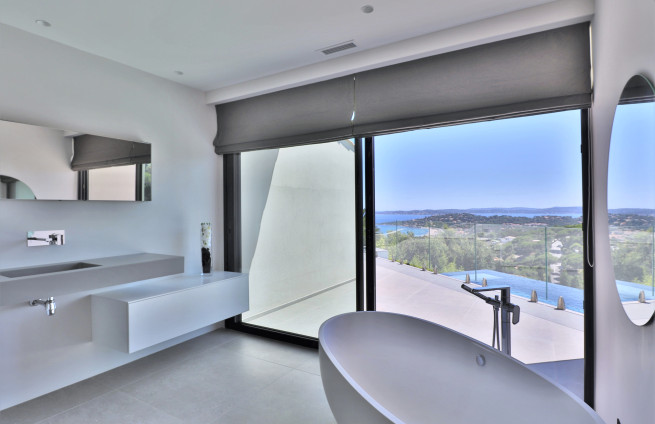 spacious master suite with walk-in shower in a luxury villa